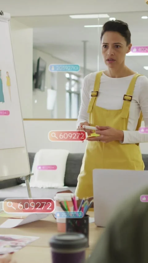 Vertical video: Designer placing sticky notes during talk as UI tags tagging Stock Footage 332775016
