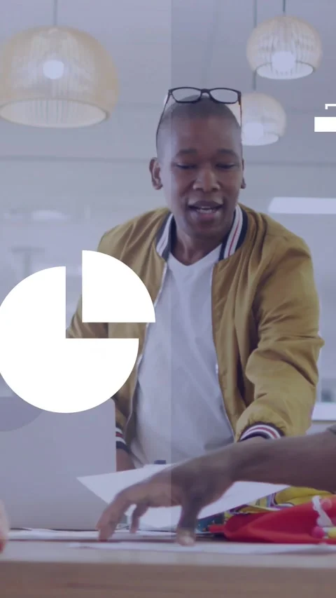 Vertical video: Designer reaching papers, sorting fabrics for project while Stock Footage 329128564