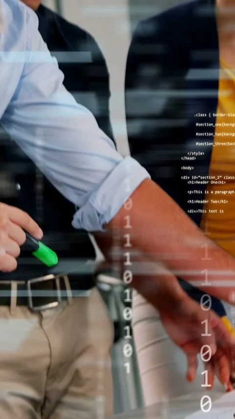 Vertical video: Designers leaning marking plans with green highlighter, code Stock Footage 333541860