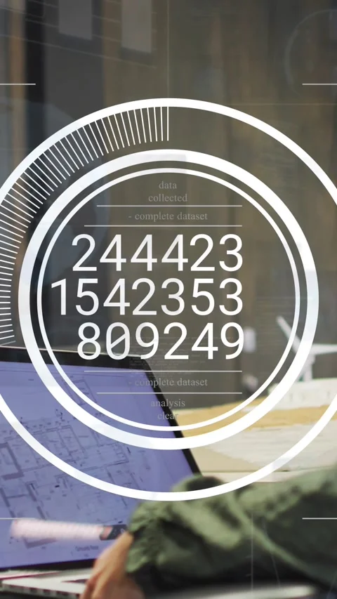 Vertical video: Desk worker reaching laptop, circular HUD appearing updating Stock Footage 328308774