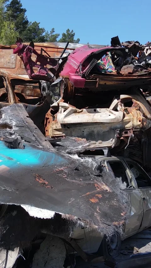 Vertical video of destroyed and shot cars in the city of Irpin, Ukraine - the Stock Footage 191864895
