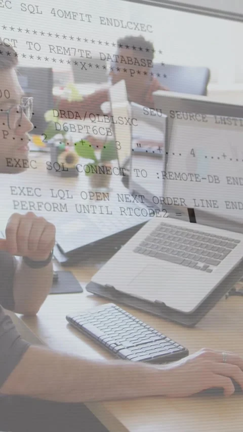 Vertical video: Dev shifting chin to mouse, creating data logs overlaying laptop Stock Footage 331790261