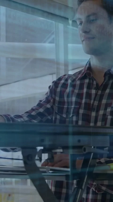 Vertical video: Dev standing at desk typing and debugging software after code Stock Footage 332506877