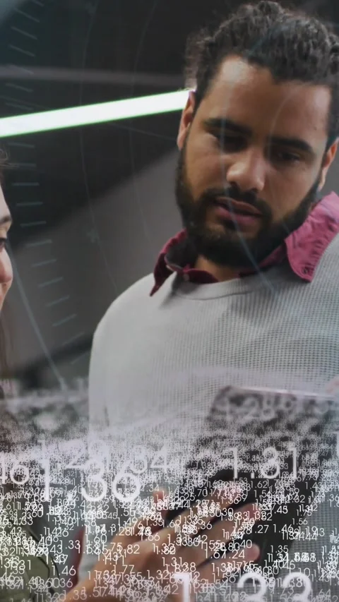 Vertical video: Dev tapping tablet and smiling as peer reaching, reviewing Stock Footage 328331815
