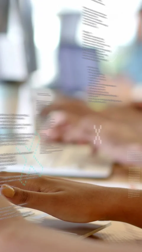 Vertical video: Dev team typing on laptops, first keypress spawning code overlay Stock Footage 334530184