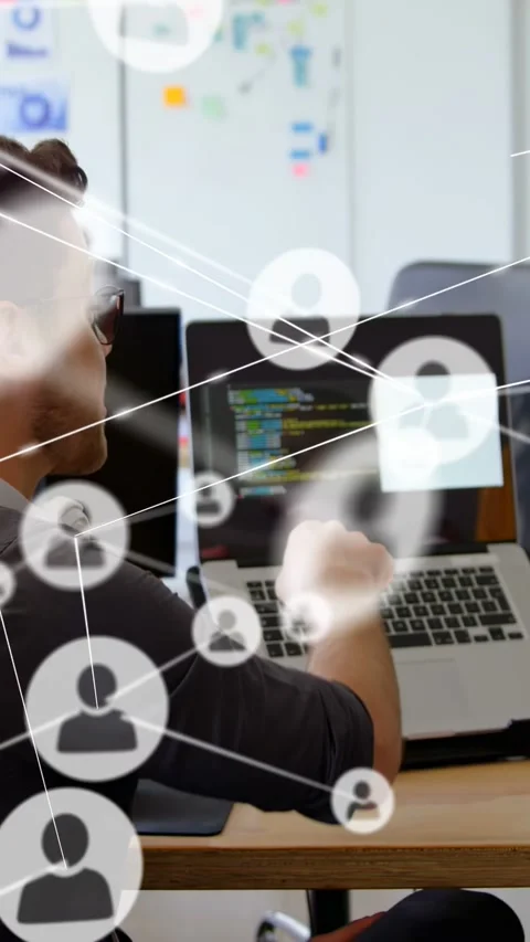 Vertical video: Dev turning and explaining code to peer while network icons Stock Footage 333020653