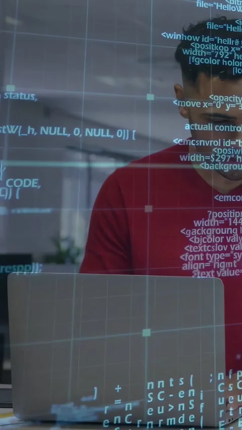 Vertical video: Dev typing, causing HUD code overlay across laptop, torso for Stock Footage 334397224