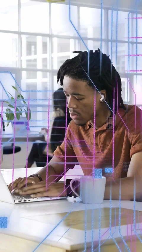 Vertical video: Dev typing at desk in tech office, starting code overlays on Stock Footage 333555999