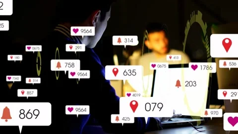 Vertical video: Dev typing on laptop showing HUD while peer watching, badges Stock Footage 332732549
