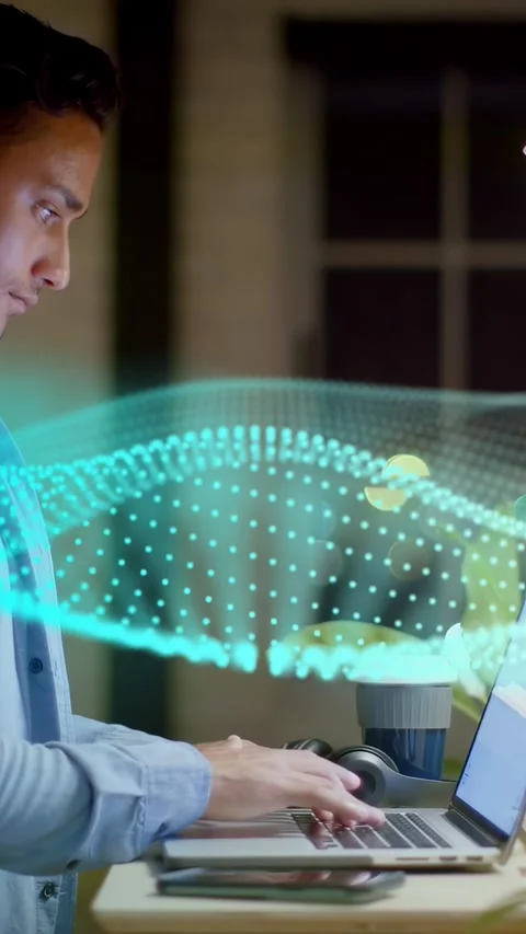 Vertical video: Dev typing on laptop at desk, starting teal wave sweeping over Stock Footage 334705054