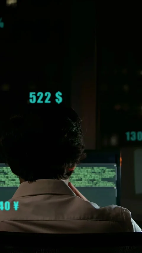 Vertical video: Dev watching green code, causing teal FX floating over desk, Stock Footage 333194942