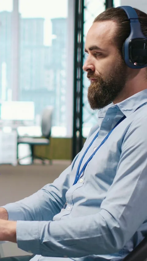 Vertical video Developer coding with AI language model assistance in office Stock Footage 312709350