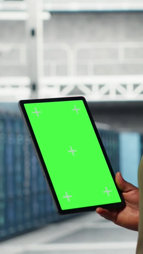 Vertical video Developer in data center using isolated screen tablet to upgrade Stock Footage 316859930