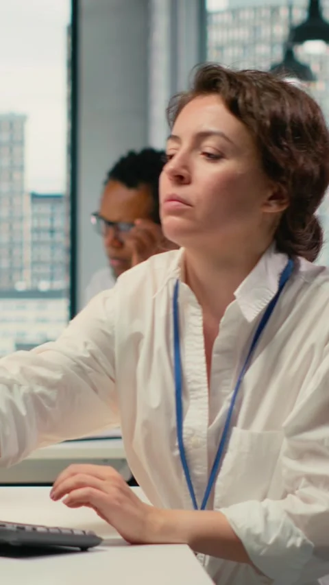 Vertical video Developer listening music while working in AI startup Stock Footage 323330677