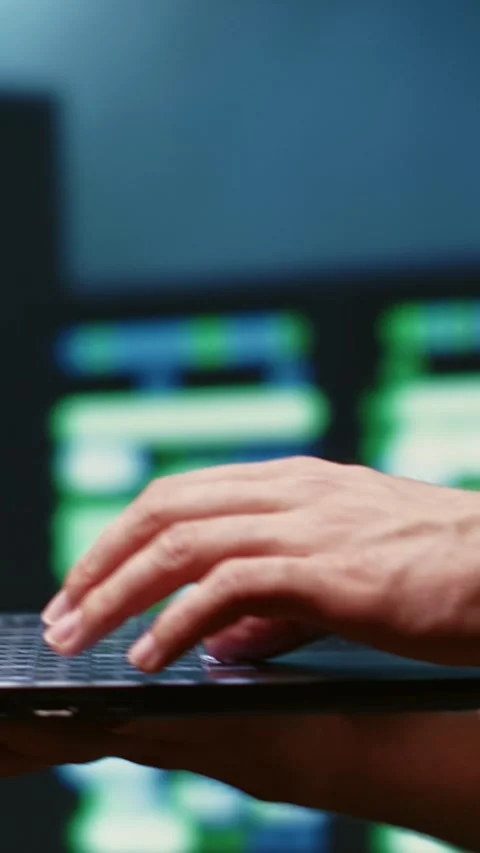Vertical video Developer monitors server farm security Stock Footage 245916554