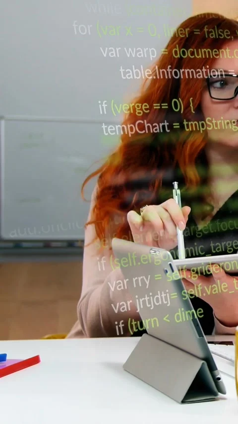 Vertical video: Developer placing stylus on tablet, editing code, generating Stockbeeldmateriaal 329961711