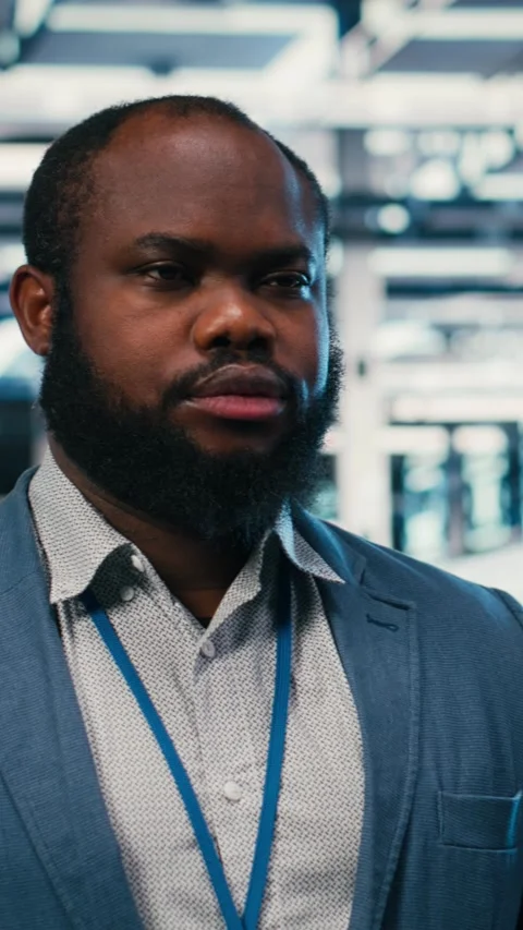 Vertical video Developer in server farm facility working, doing network Stock Footage 330084052