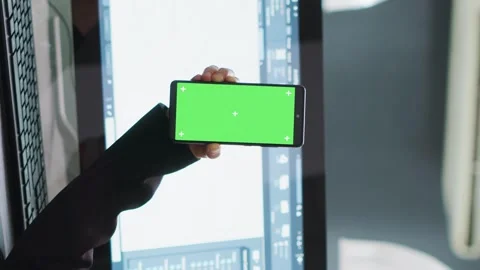 Vertical Video Developer shows mobile phone with greenscreen template Stock Footage 263080908