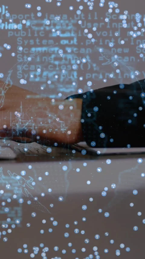 Vertical video: Developer typing on laptop and driving globe, code and data Stock Footage 329961972