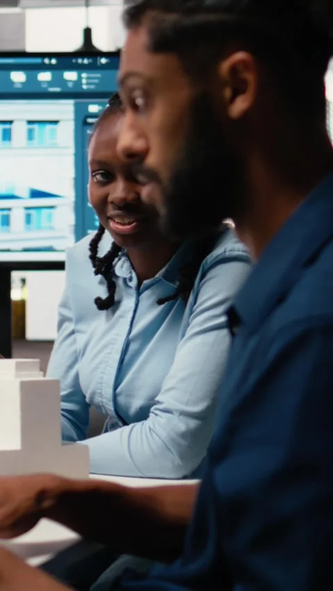 Vertical Video Developers team reviewing digital project interior designs and Stock Footage 316340173