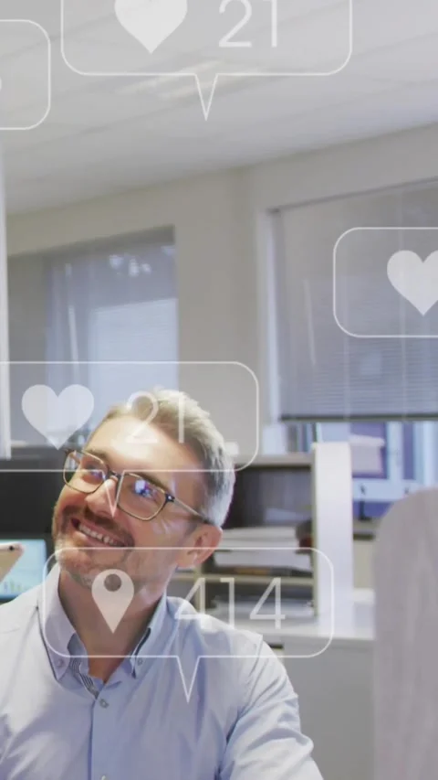 Vertical video: Device pinging, man looking up smiling while overlays Stock Footage 334598849