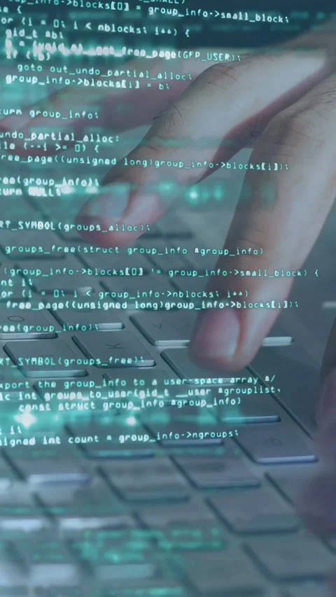 Vertical video: Dev's hands moving to keys, typing after teal code overlay over Stock Footage 335355593