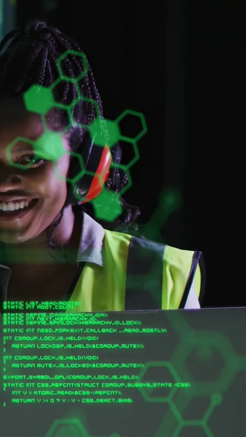 Vertical video: Diagnostics appearing, operator in vest checking laptop for Stock Footage 332775227