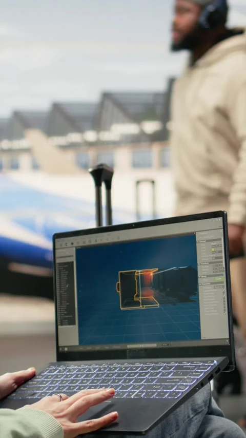 Vertical Video Digital nomad game developer working on laptop in international Stock Footage 333611884