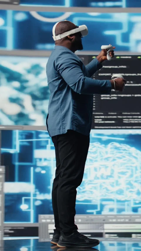 Vertical Video Digital tech expert coding and using VR headset at innovation hub Stock Footage 312177158