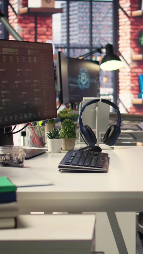 Vertical Video Digital workstation features multiple PC monitors running Stock Footage 308492680