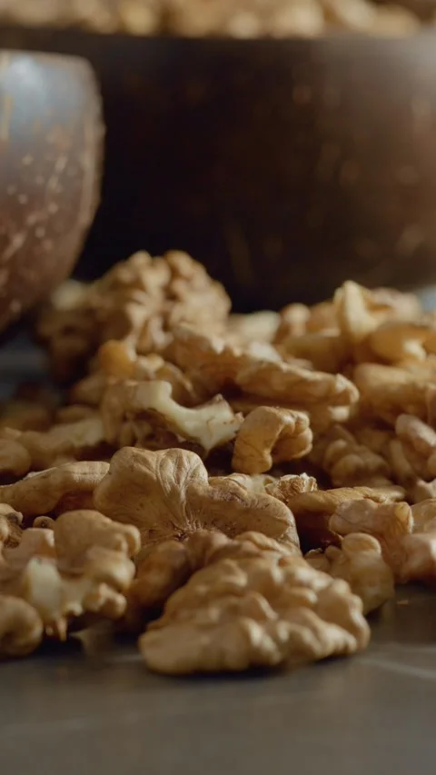 Vertical video Discovering the benefits of walnut kernels for your health Stock Footage 329617684