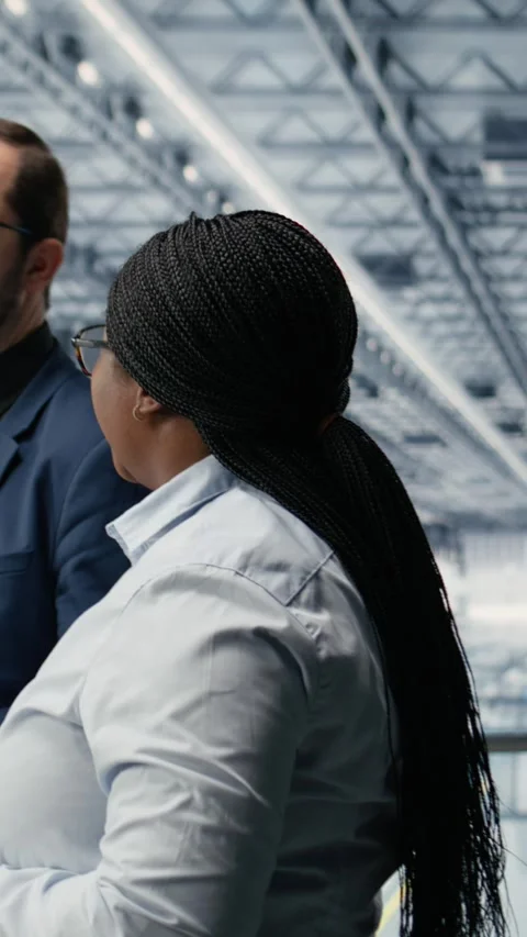 Vertical video Discussing, microchip and female manager with researcher in Stock Footage 333614118