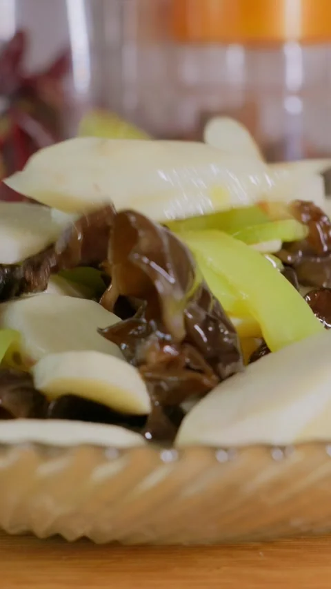 Vertical Video: Dish made with mushrooms, lettuce stem and Chinese yam Stock Footage 341837493
