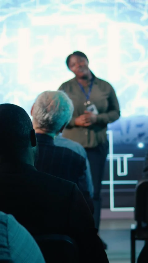 Vertical Video Diverse audience clapping hands and listening to AI presentation Stock Footage 328331615