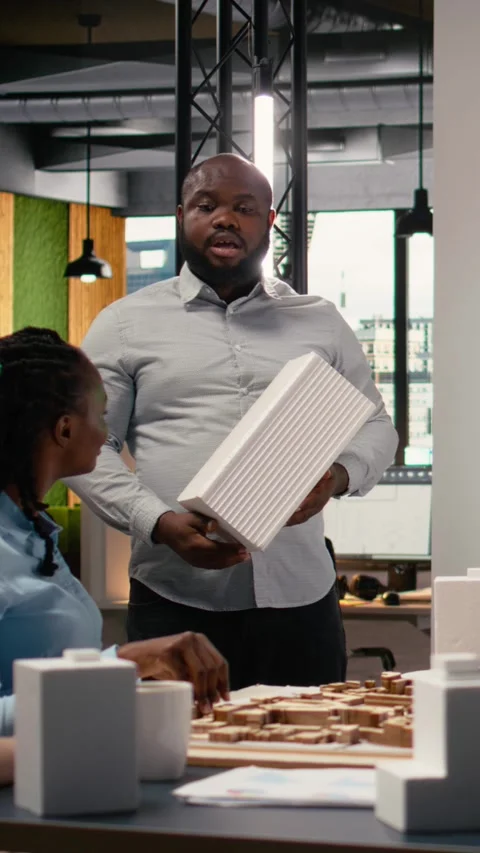 Vertical Video Diverse developers staff review zoning regulations next to copy Stock Footage 316340269