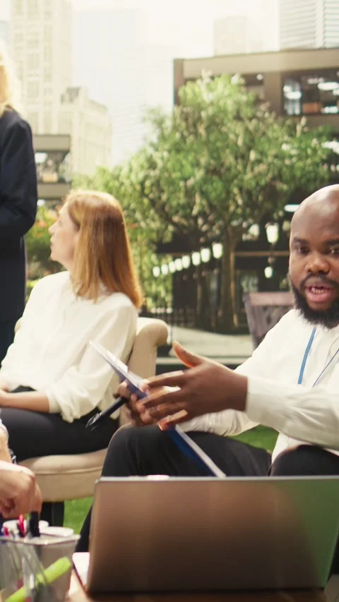 Vertical Video Diverse men in outdoor business meeting making handshake Stock Footage 339070583