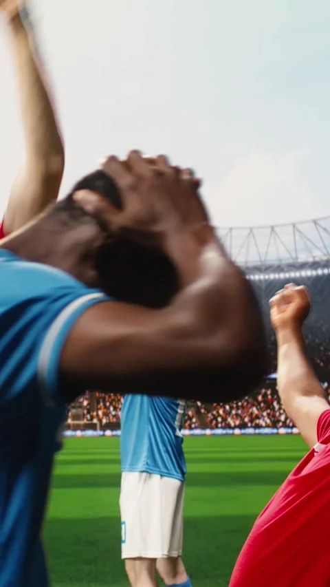Vertical Video Diverse red soccer players celebrating match with joyful goal Video stock 338046943