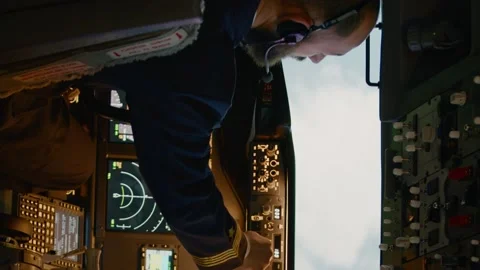 Vertical video: Diverse team of captain and copilot using dashboard command Stock Footage 196965298