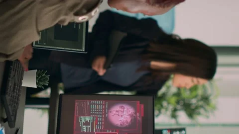 Vertical video: Diverse team of database admins having hacked server and 스톡 동영상 219702130