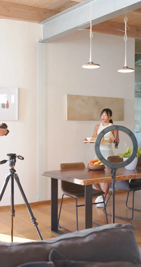 Vertical video: Diverse team styling table, Asian woman posing with cake, man 스톡 동영상 335896765