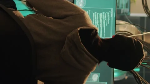 Vertical video: Diverse team of thieves committing cyber attack with computer Stock-Footage 228660050