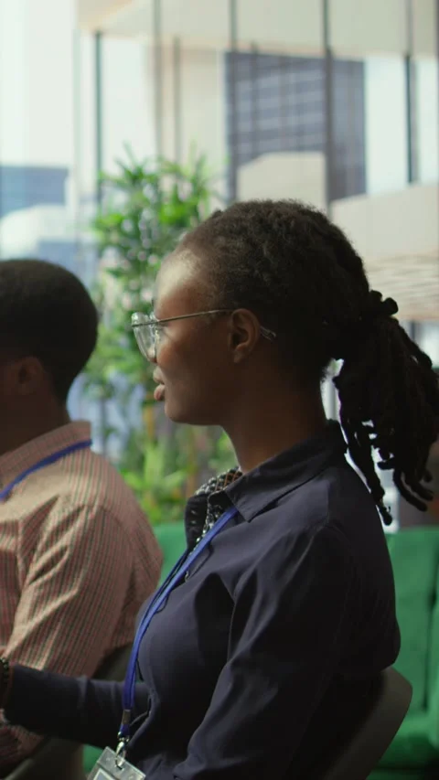 Vertical Video Diverse work team collaborating on project management tasks Stock Footage 319246649