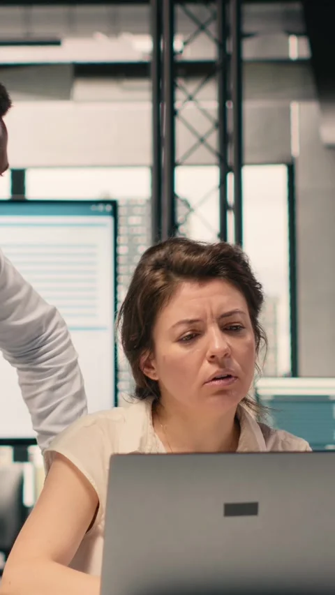 Vertical Video Diverse work team in a multinational company office discussing Stock Footage 329320917