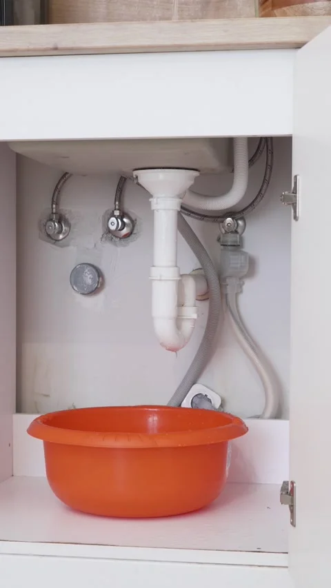 Vertical Video of DIY Fix on Kitchen Sink Drain Stock Footage 311501873