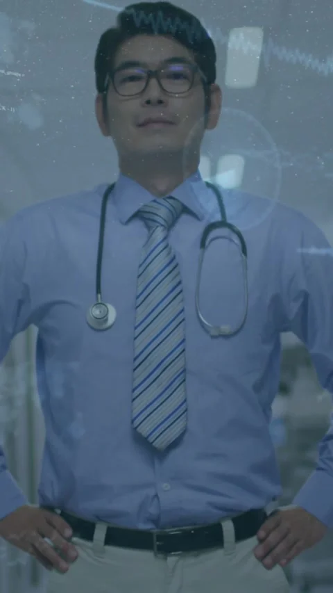 Vertical video: Doc standing in clinic camera panning causing audio or code Stock Footage 330509847