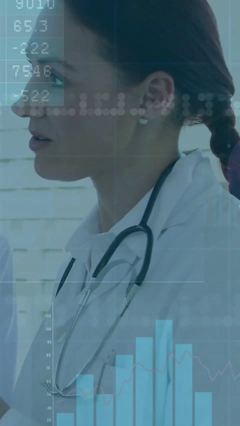 Vertical video: Doctor on data update in clinic, assessing HUD with rising Stock Footage 331271187