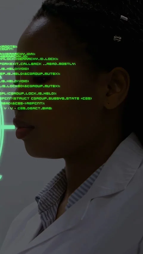 Vertical video: Doctor facing green HUD activating streaming code over face Stock Footage 334540437