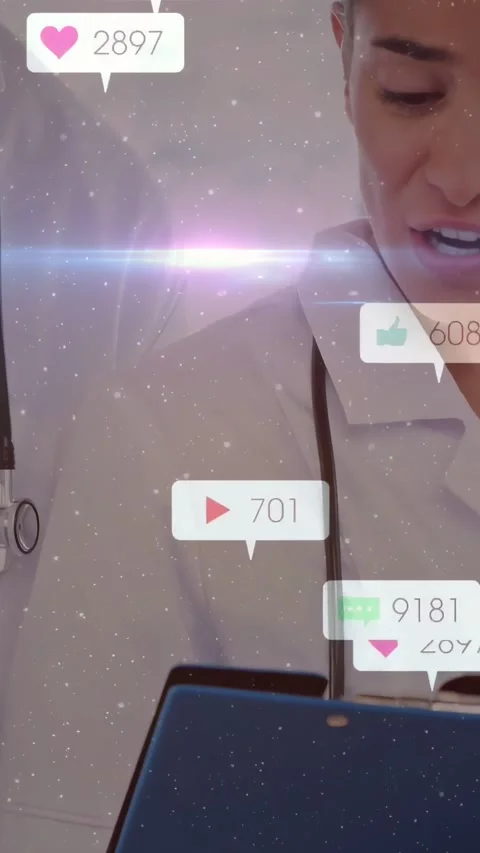 Vertical video: Doctor holding tablet in clinic heart icons appearing and Stock Footage 332687523