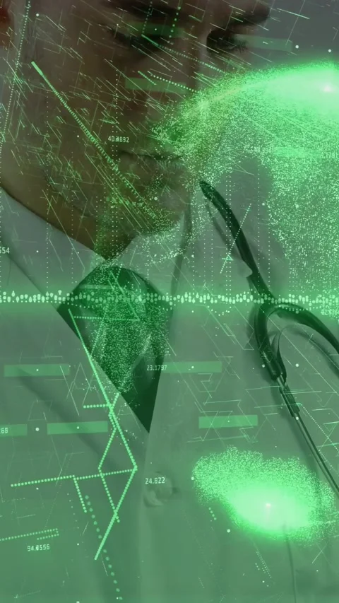 Vertical video: Doctor tapping device causing green charts pulsing while 動画素材 328769466