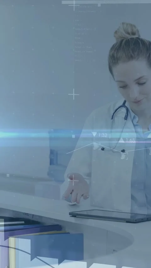 Vertical video: Doctor using tablet showing animated data at desk handling white Stock Footage 333157826